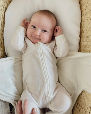 Baby in an Organic Cotton Babu Onesie