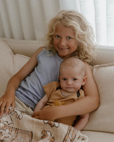 Children’s Merino Clothing Singlet and Bodysuit worn by siblings during a family photoshoot