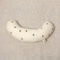 The Bee tummy time support aid helps newborn babies during their floor time. Made from a supportive wooden lining and a washable cotton cover. The fabric print has bees printed on it.