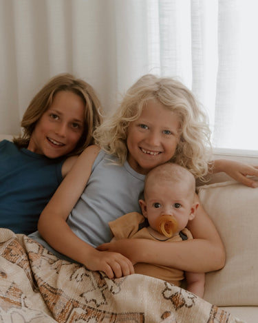 Newborn baby and older brother family photography wearing Babu Basics Singlet and Bodysuit